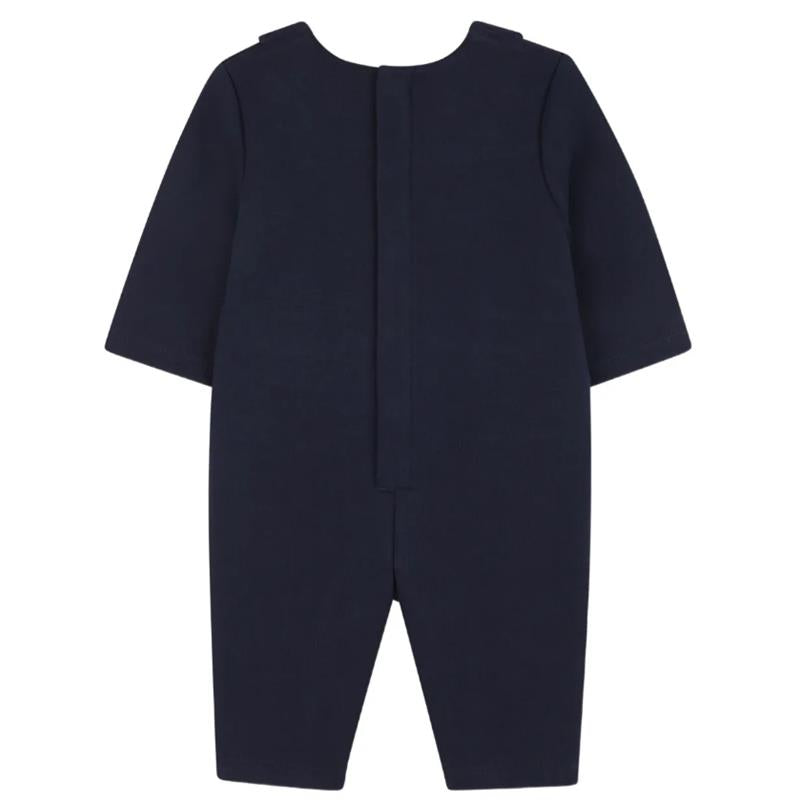 Navy blue romper for boys, featuring short sleeves and a back closure, designed in a suit style.
