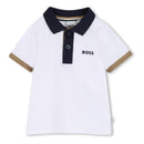 Baby cotton polo shirt in white with navy collar and brown accents, featuring the BOSS logo on the chest.