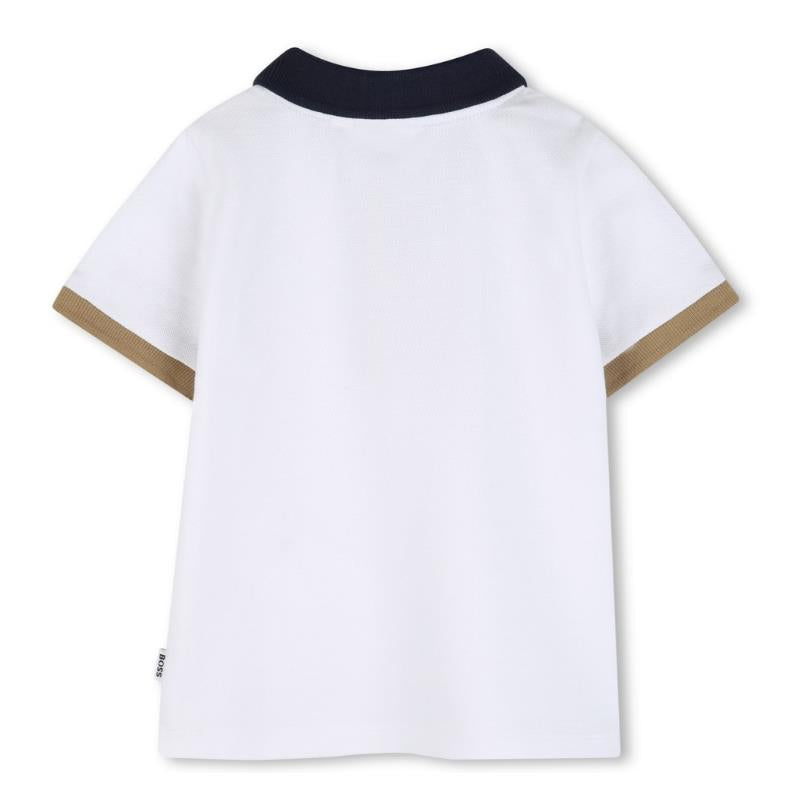 White cotton polo shirt with a navy collar and beige cuffs, featuring the Hugo Boss logo.