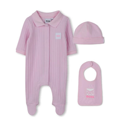 Light pink footie hat, bib, and romper set for girls, featuring a collar and Boss logo, presented in a gift box.