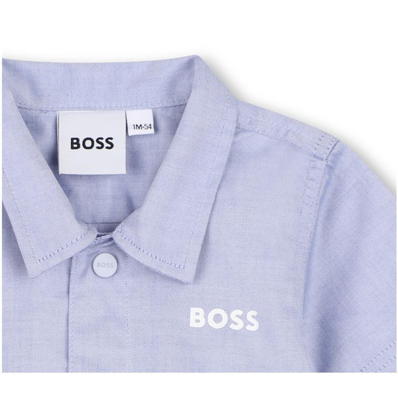 Light blue Hugo Boss baby shirt with a collar, featuring a button and the brand logo prominently displayed.