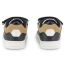 Black Hugo Boss baby sneakers made of cow leather and canvas, featuring a stylish design with contrasting tan accents.