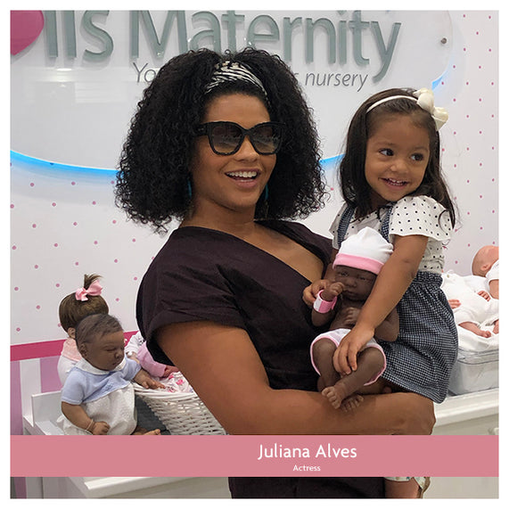 Juliana Alves and her daughter adopting a Baby Doll at MacroBaby in Orlando, Florida
