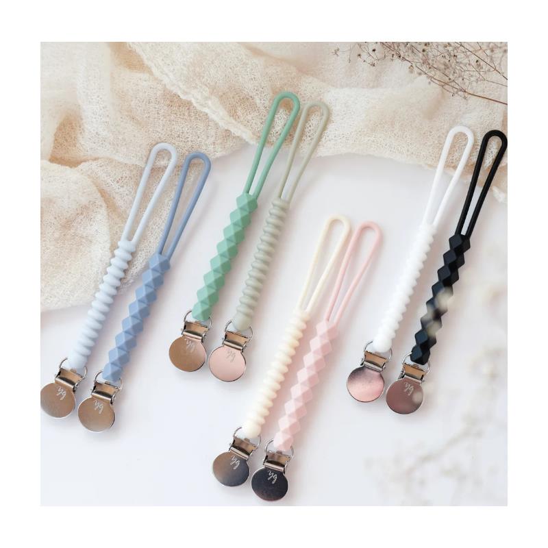 Silicone pacifier holders in pastel colors with clips, featuring textured designs and a black/white color scheme.