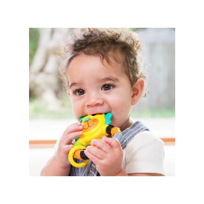 Toddler happily chewing on a colorful Infantino Bendy Teether shaped like a lion, featuring bright colors and a handle.