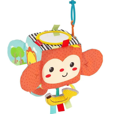 Colorful soft cube toy featuring a smiling monkey face, various textures, and interactive tags for sensory play.