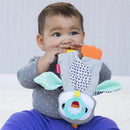 Infantino Cuddly Teether penguin toy being held and chewed on by a smiling baby wearing a gray polka dot shirt.