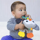 Infantino Cuddly Teether Penguin toy being chewed on by a baby wearing a grey polka dot shirt and blue pants.