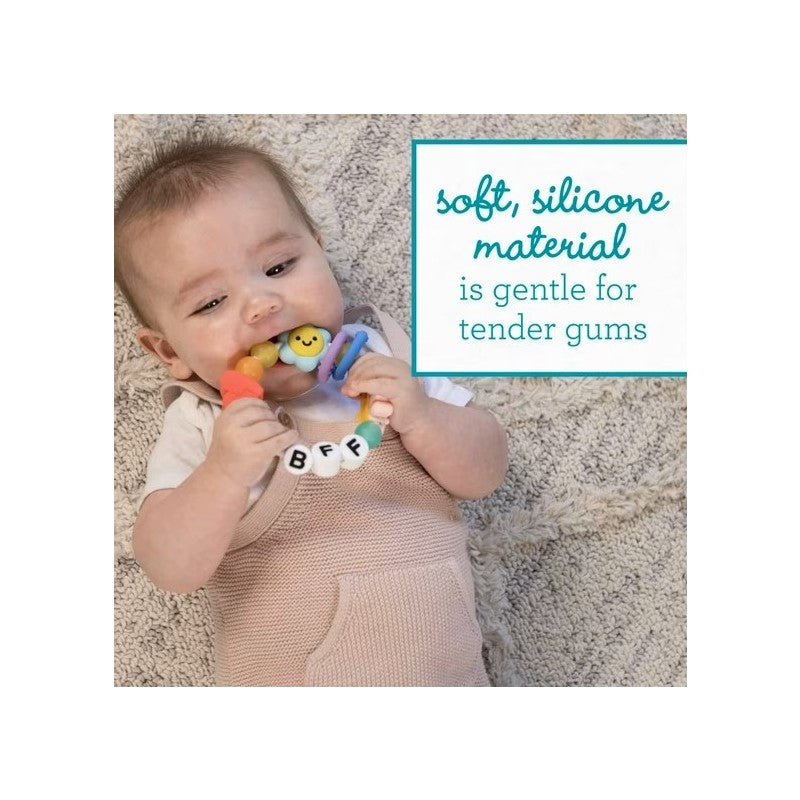 Infantino Friendship Teether, featuring colorful beads and a smiling face, being used by a baby to soothe gums.