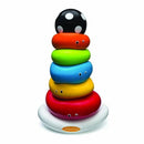 Colorful Infantino Funny Faces Ring Stacker featuring six smiling rings stacked on a white base, topped with a polka-dotted black ball.