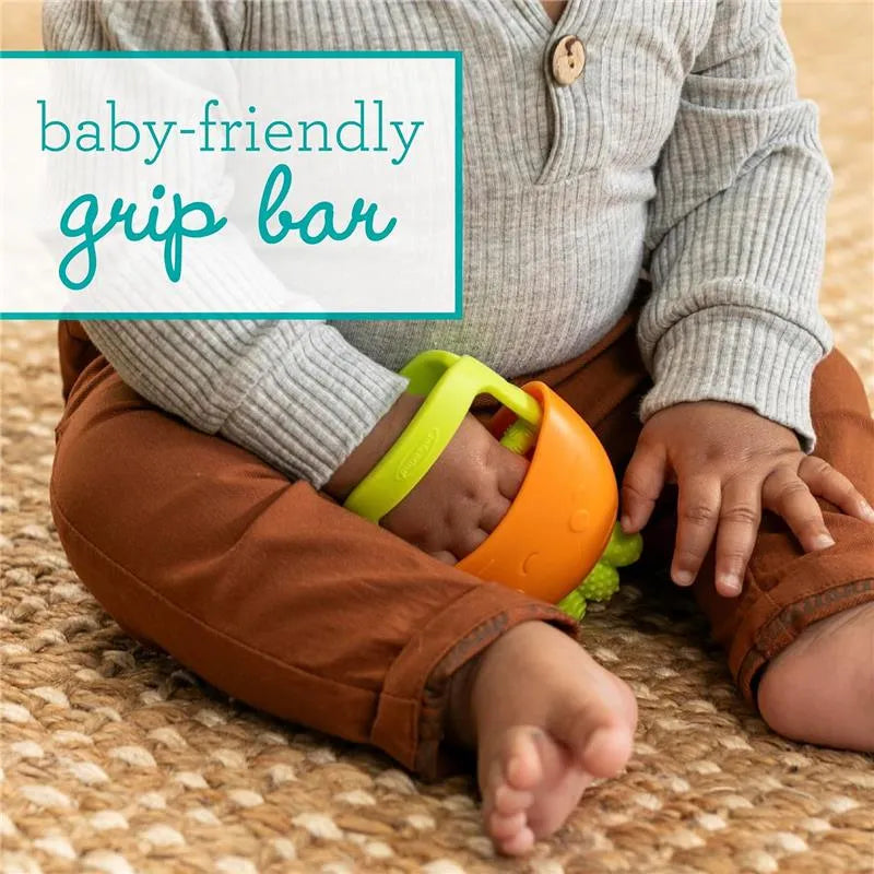 Infantino Handy Dandy Teething Mitt in carrot design, held by a baby, featuring a baby-friendly grip bar.