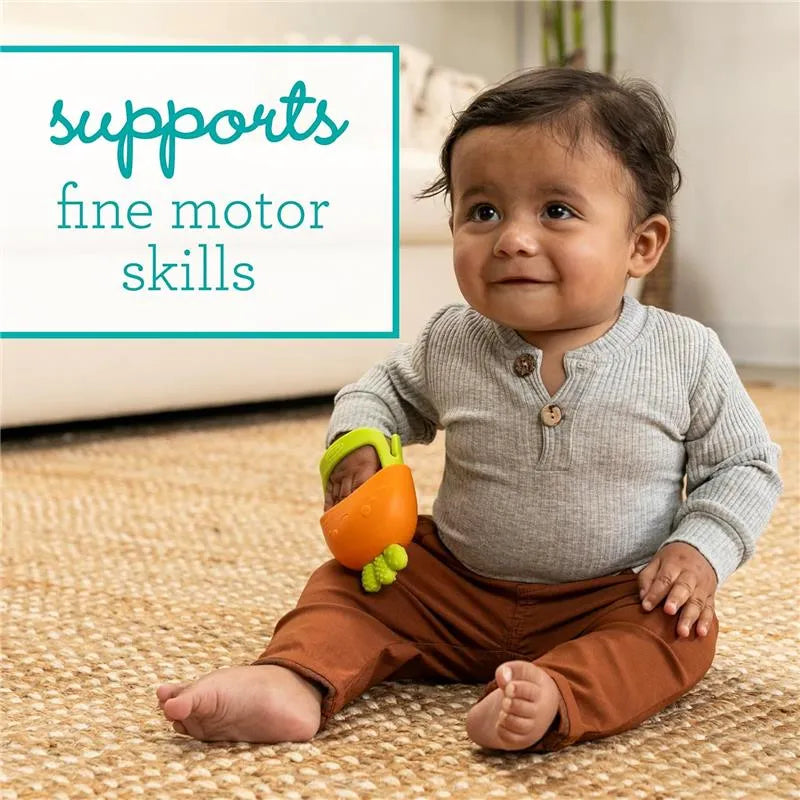 Infantino Handy Dandy Teething Mitt in orange held by a smiling toddler, promoting fine motor skills development.