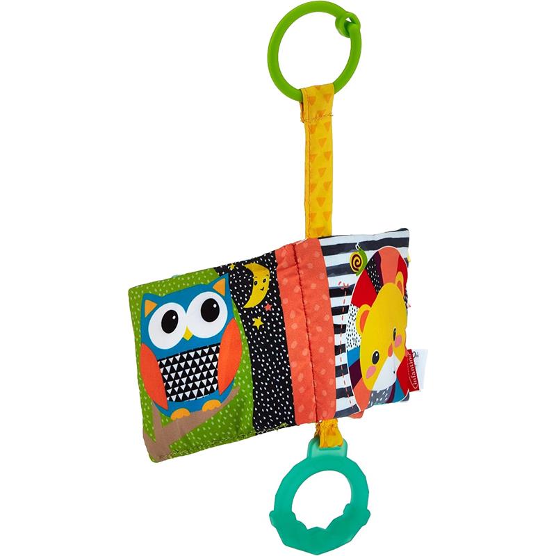 Colorful fabric baby book featuring an owl and a lion, includes a green ring for attachment.