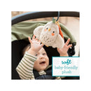 Soft baby-friendly plush toy, Olive the Owl, being reached for by an excited baby in a stroller.