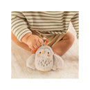 Infantino Mini Plushy Pal & Teether, Olive the Owl, with a child holding it, featuring soft gray fabric and vibrant details.