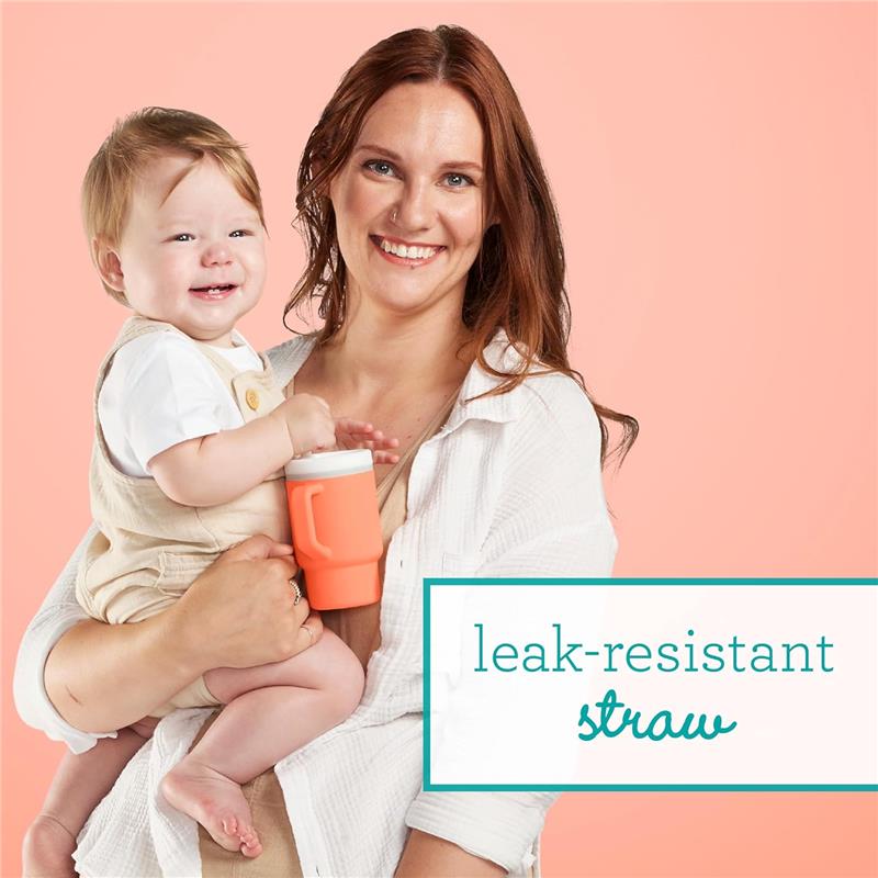 Soft silicone 9 oz cream tumbler held by a smiling mother with a baby, highlighting its leak-resistant straw feature.
