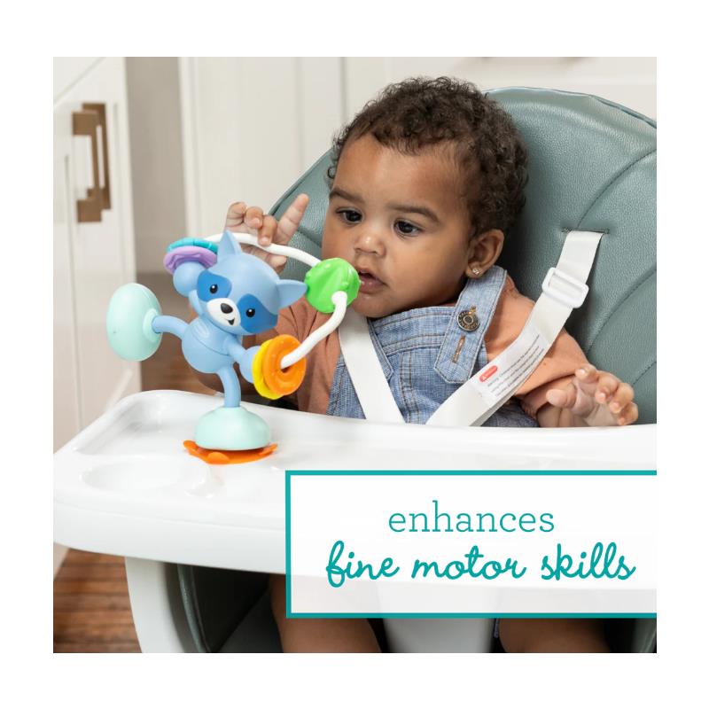 Infantino Stick & Spin Pal, Raccoon toy on a high chair; enhances fine motor skills for a toddler engaged in play.