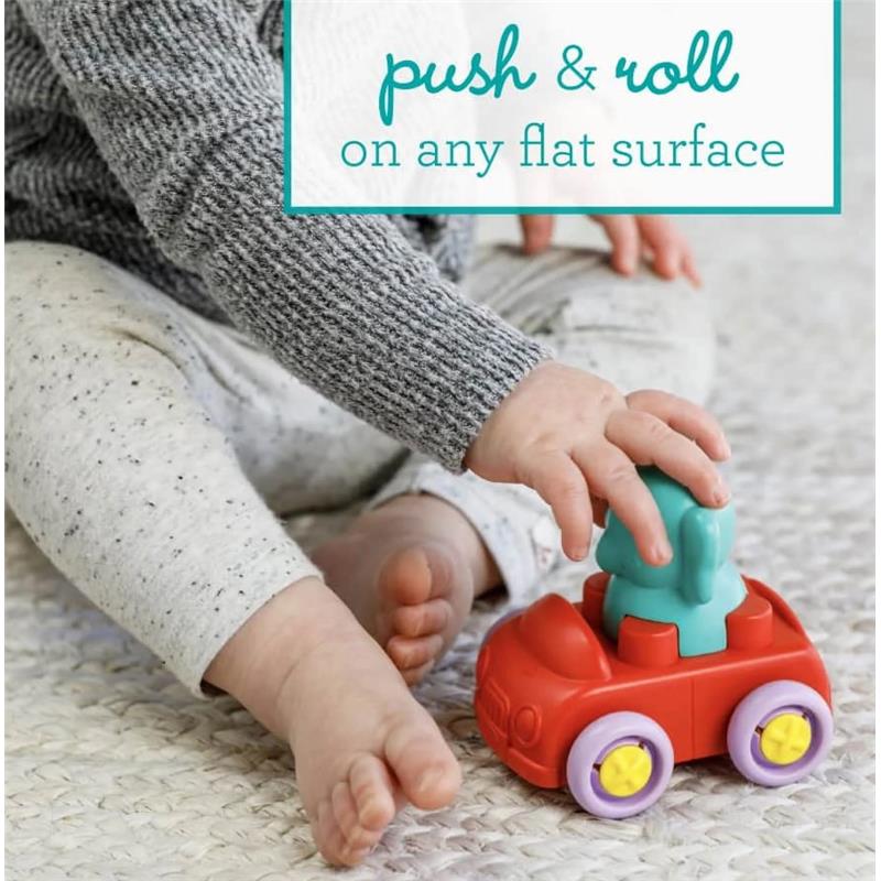Child playing with Infantino Super Soft Stack & Go Explorer toy car, featuring a removable figure on a red car with colorful wheels.