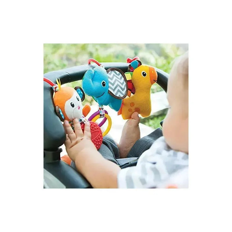 Infantino Tag Along Travel Pals features colorful animal toys, including a monkey, elephant, and giraffe, attached to a stroller.