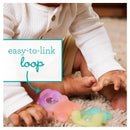 Infantino Teethimal Pop Pals - Gummy Bears featuring a baby playing on a rug, interacting with colorful, linked teething toys.