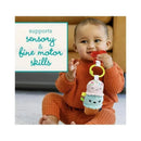 Plush ice cream toy and red teether held by a baby, highlighting sensory and fine motor skills development.