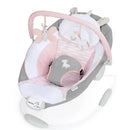 Soothing baby bouncer seat in pink and gray, featuring a unicorn and butterfly toys with vibration settings.