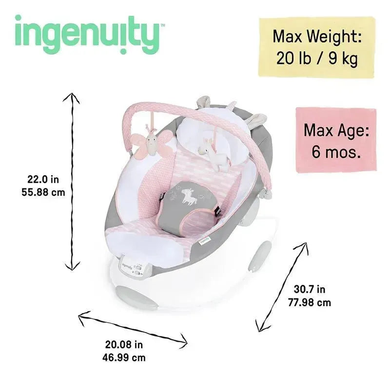 Soothing baby bouncer seat with pink and gray fabric, butterfly and unicorn toys, and vibration feature; dimensions and weight limits displayed.