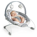 Automatic baby bouncer seat featuring a smiling baby, plush fabric, and hanging toys for entertainment.