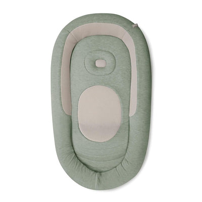 Inglesina Welcome Pod Lounger in Balance Green with a soft, rounded design and breathable fabric for infant comfort.