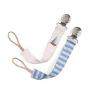 Two fabric pacifier straps in boat stripe pattern, one with a sailboat embroidery and silver clips for attachment.