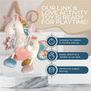 Plush unicorn activity toy with teether, featuring colorful accents and attachments for strollers or car seats, suitable for infants.
