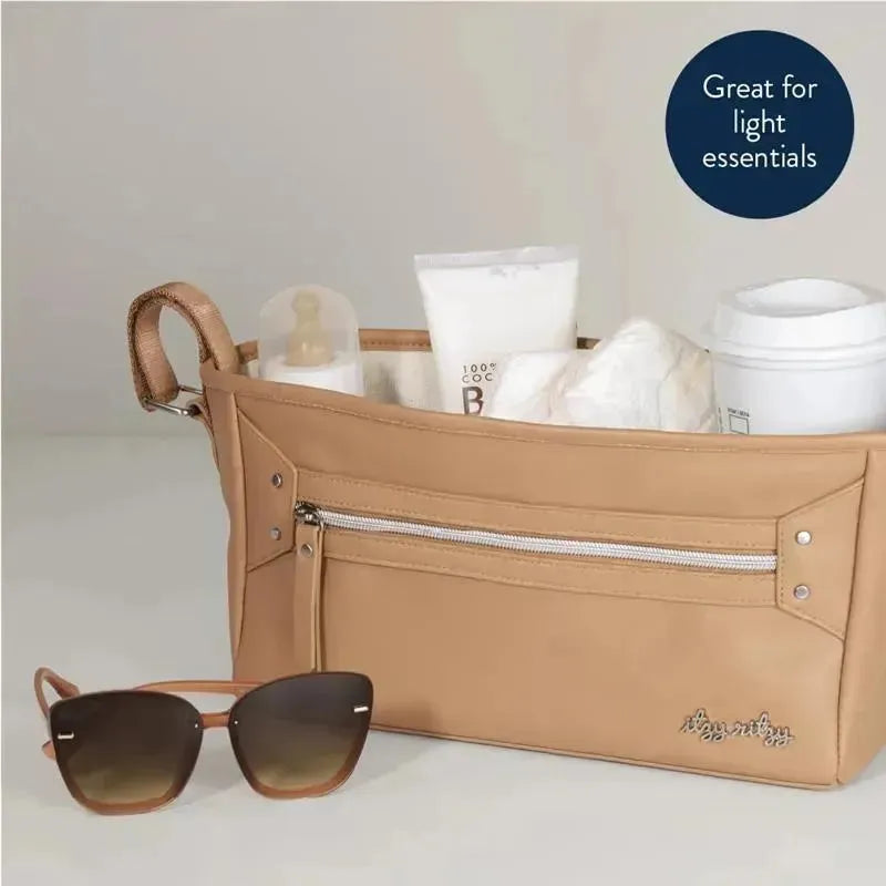Adjustable stroller caddy in chai color featuring a zippered pocket, holding baby essentials and sunglasses.