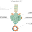 Attachable travel toy cactus with soft fabric, crinkle arms, bouncy strap, and hexagon rings for grasping.