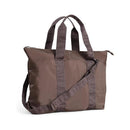 Multipurpose Itzy Ritzy Belong All-In-Tote in mocha, featuring dual handles and a removable shoulder strap.