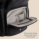 Black Itzy Ritzy Belong Bucket Backpack™ showing an interior parent pocket with slip pockets, zipper pocket, and key lanyard.