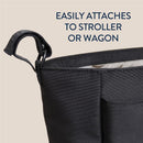 Black Itzy Ritzy Belong Carry-All Caddy with a strap for attachment to a stroller or wagon; features a spacious interior.