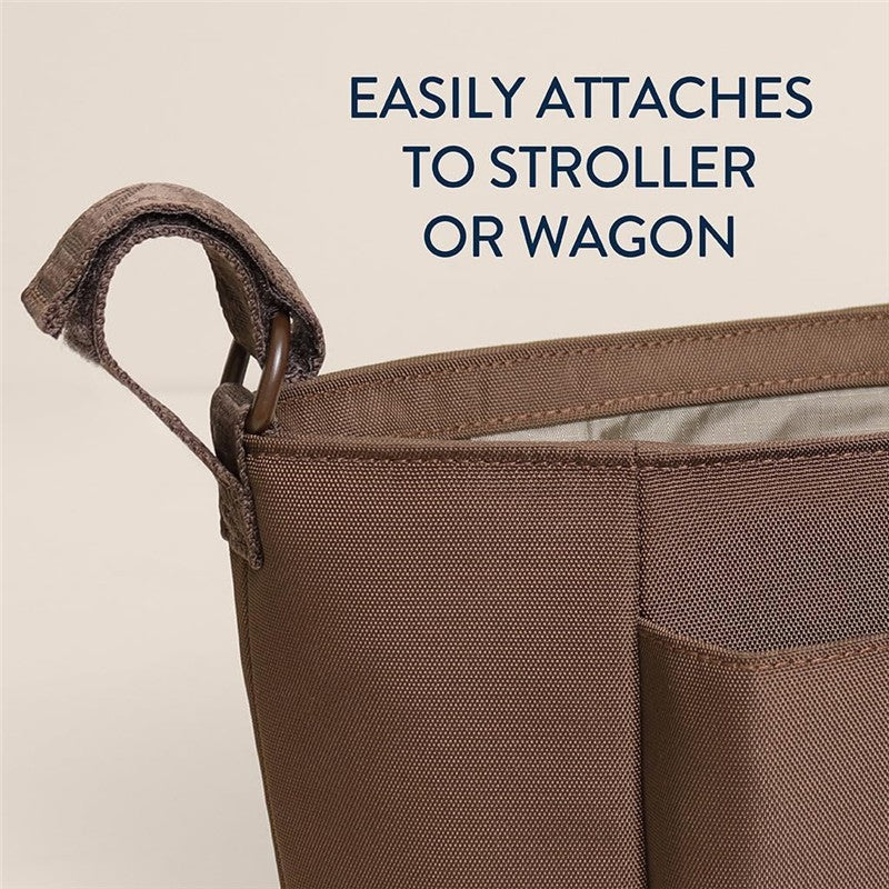 Belong Carry-All Caddy features a brown fabric with a strap for easy attachment to strollers or wagons, promoting convenience.