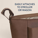 Belong Carry-All Caddy features a brown fabric with a strap for easy attachment to strollers or wagons, promoting convenience.
