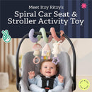 Itzy Ritzy Bitzy Spiral activity toy features colorful plush links, a house, rabbit, and ring, suspended above a smiling baby in a car seat.