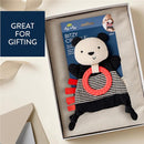 Bitzy Crinkle sensory toy panda with crinkle sound, featuring a textured ring and ribbon details, presented in a gift box.