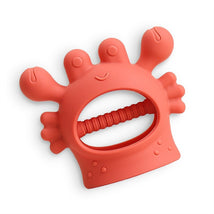 Silicone teether shaped like a crab, featuring a smiling face and textured handle for babies to grip.