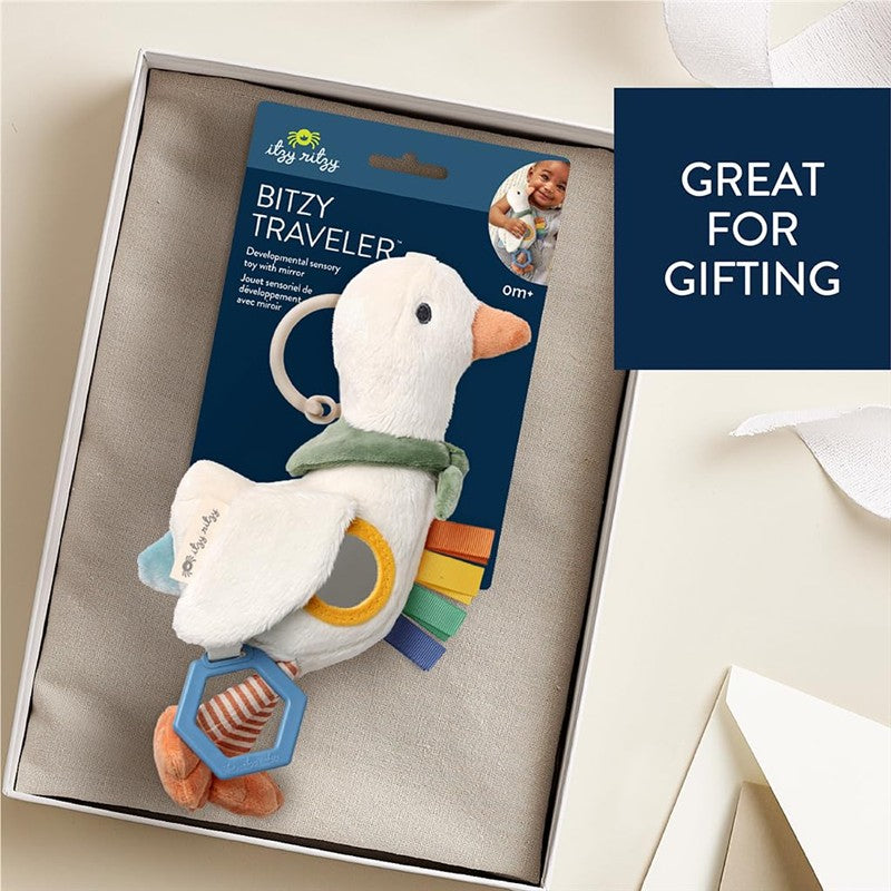 Bitzy Traveler car seat and stroller toy featuring a plush duck with a clip, sensory features, and colorful rings.