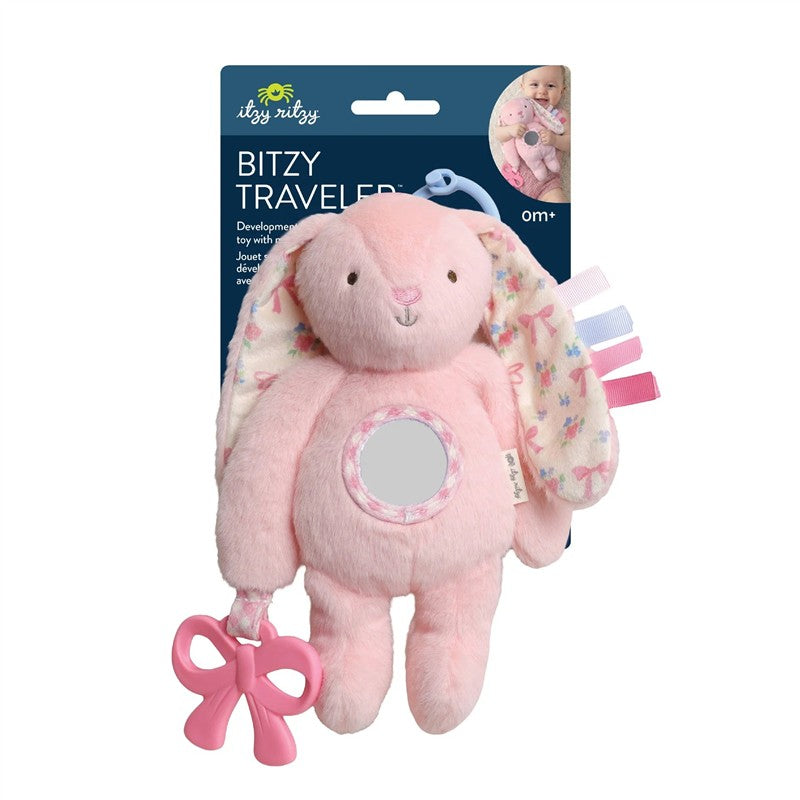 Soft pink bunny sensory toy with patterned ears, a touch mirror, and a bow-shaped teether attached.