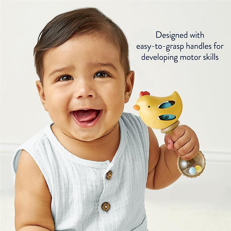 Smiling baby holding a yellow chicken-shaped rattle with easy-to-grasp handles, promoting motor skill development.