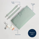 Green changing pad, stroller straps, and a goose charm keychain from the Itzy Ritzy Boss Plus™ Backpack Diaper Bag.