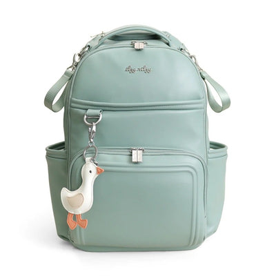 Light green Itzy Ritzy Boss Plus™ Backpack Diaper Bag with a duck-shaped keychain attached, featuring multiple compartments.
