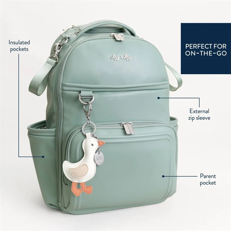 Mint green Itzy Ritzy Boss Plus™ Backpack Diaper Bag featuring a duck charm, insulated pockets, and external zip sleeve.