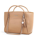 Chai latte Itzy Ritzy Boss Tote™ diaper bag features a sleek design, chain accent, tassel, and logo detail.