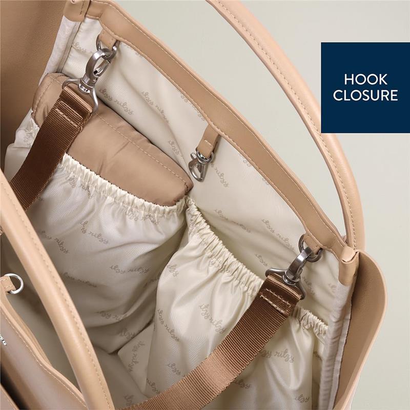 Diaper bag featuring a chai latte color, hook closure, and interior pockets for organization.
