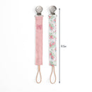 Two fabric pacifier clips, one pink with a bow design and one floral, each 9.5 inches long.
